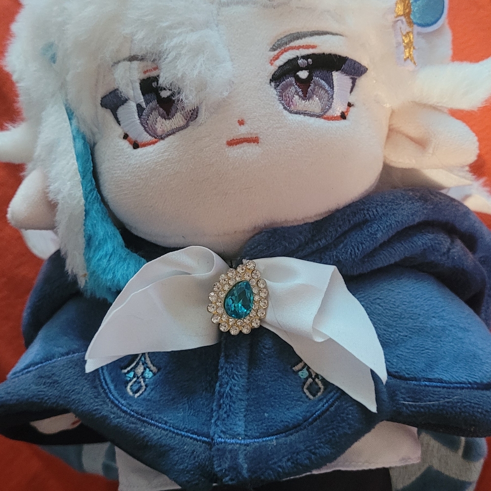Plush Doll with Blue Cape and White Bow